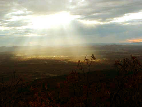 A burst of light illuminates the valley below. photo by Tammy Skidmore Rich A burst of light illuminates the valley below. photo by Tammy Skidmore Rich